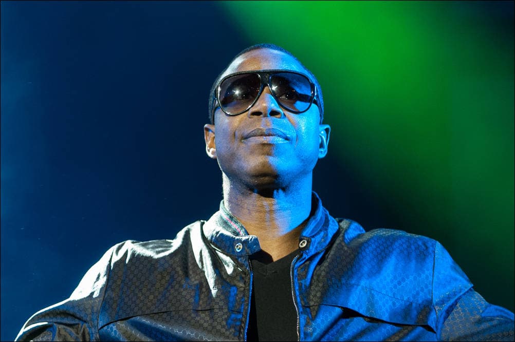 From the Perform Collection. Doug E Fresh. A color photograph by Jeff Kauffman of a performance by hip hop artist Doug E Fresh. ©Jeff Kauffman