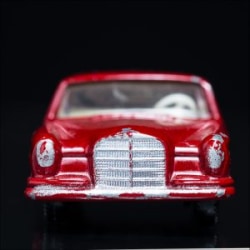 From the Carface collection. Mercedes Benz 220SE, Matchbox Series No. 53. A color photograph by Jeff Kauffman of a vintage matchbox car. ©Jeff Kauffman