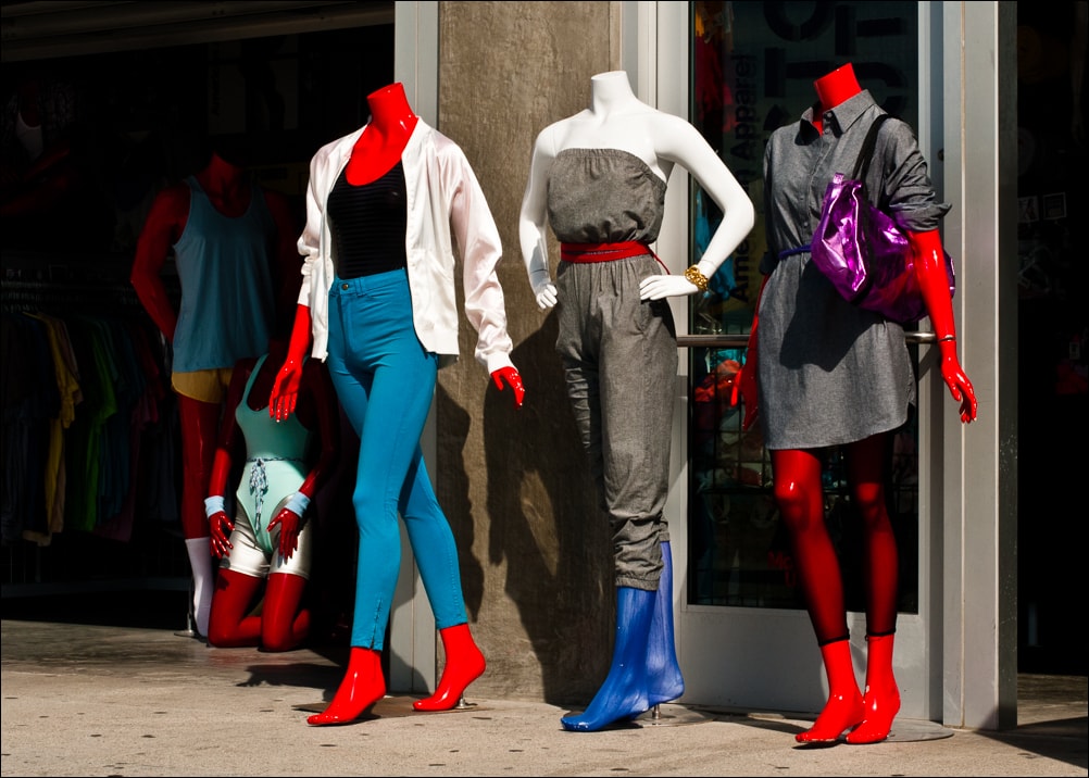 Explore. I See Red People. A photograph by Jeff Kauffman of red mannequins outside a beach fashion shop in Venice, CA USA.
