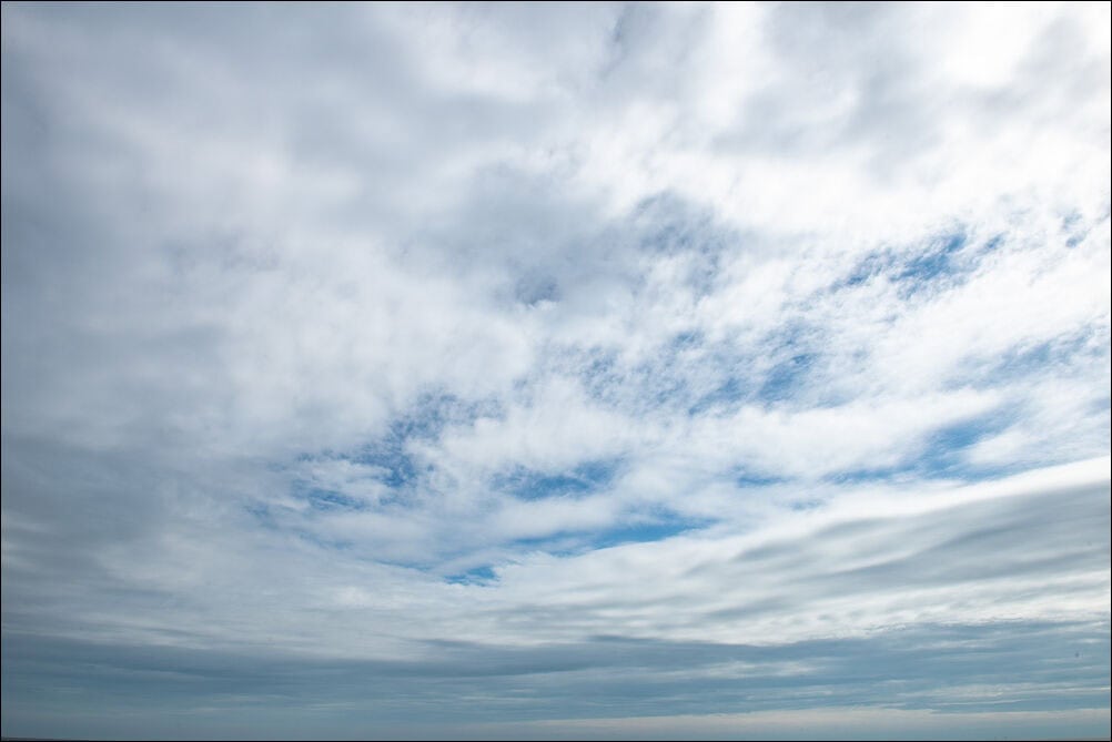 Expansive Sky #0100. Dramatic white clouds against a blue sky. Photograph by photographer Jeff Kauffman of Austin, Texas USA. ©Jeff Kauffman